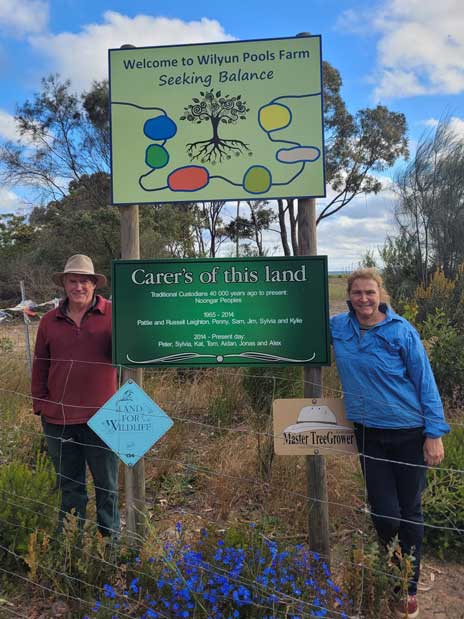 WA Landcare Award Winners standing next to their reserve signage