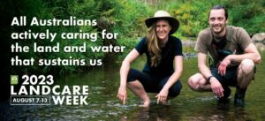 Two landcarers crouching in a stream, with banner text beside them